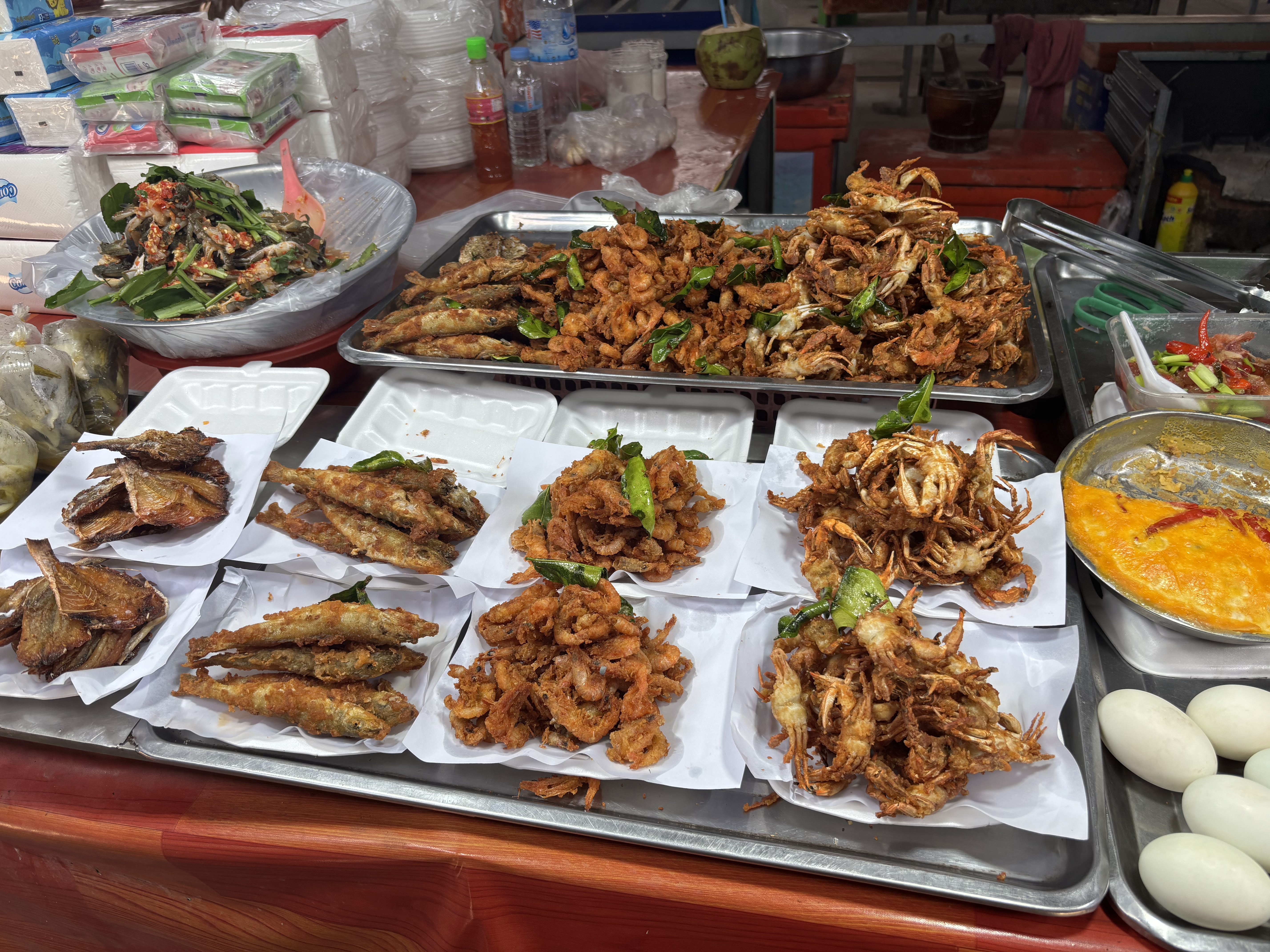 Vendors selling seafood at the market